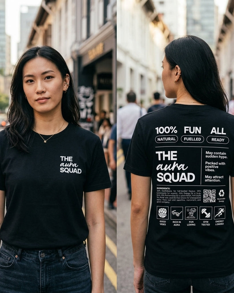 Person wearing a black t-shirt with 'The Auto Squad' text on a city street.