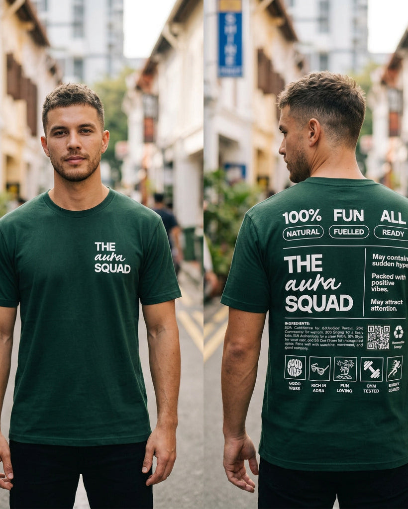 Two men wearing green t-shirts with text, one facing forward and one facing backward, in an urban setting.